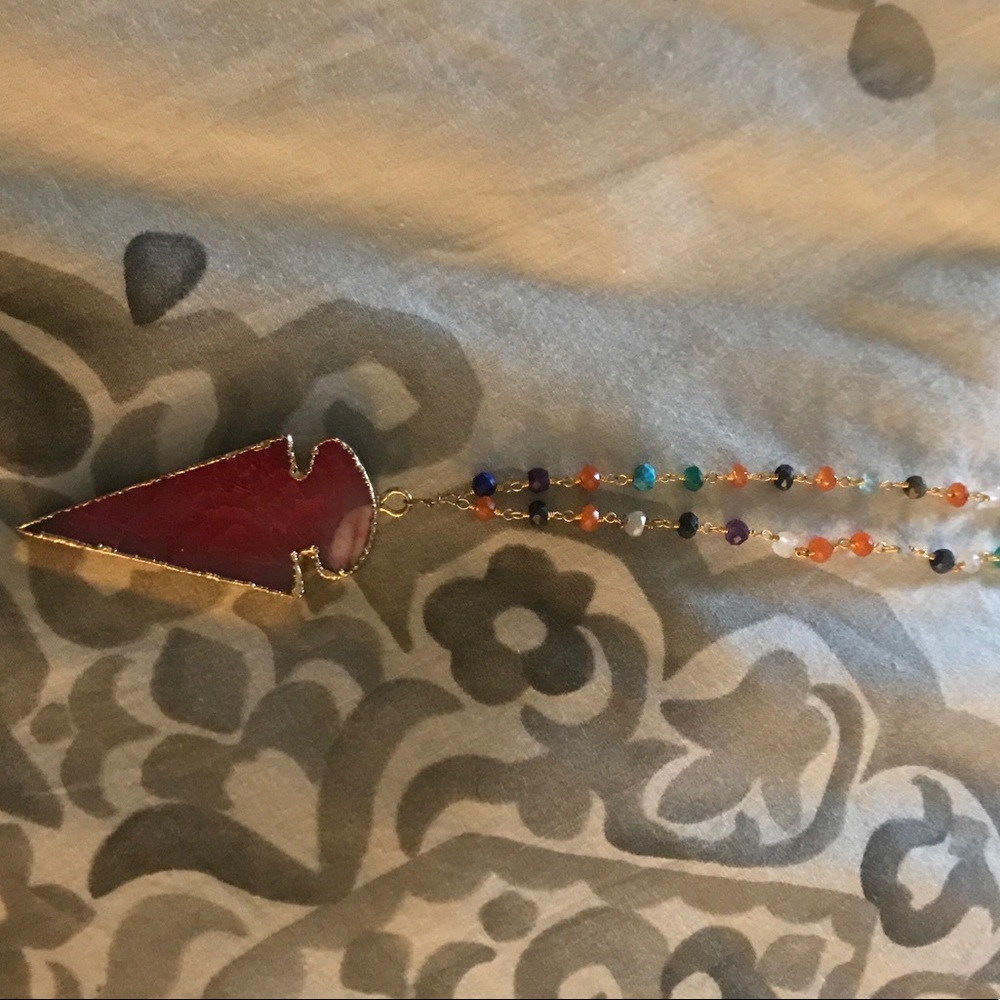 multicolored rosary chain with pink arrowhead